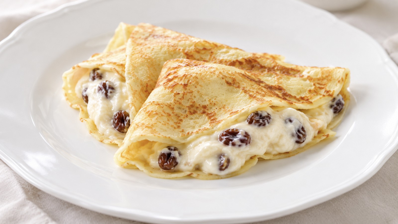 Crêpes con quark e uvetta al rum